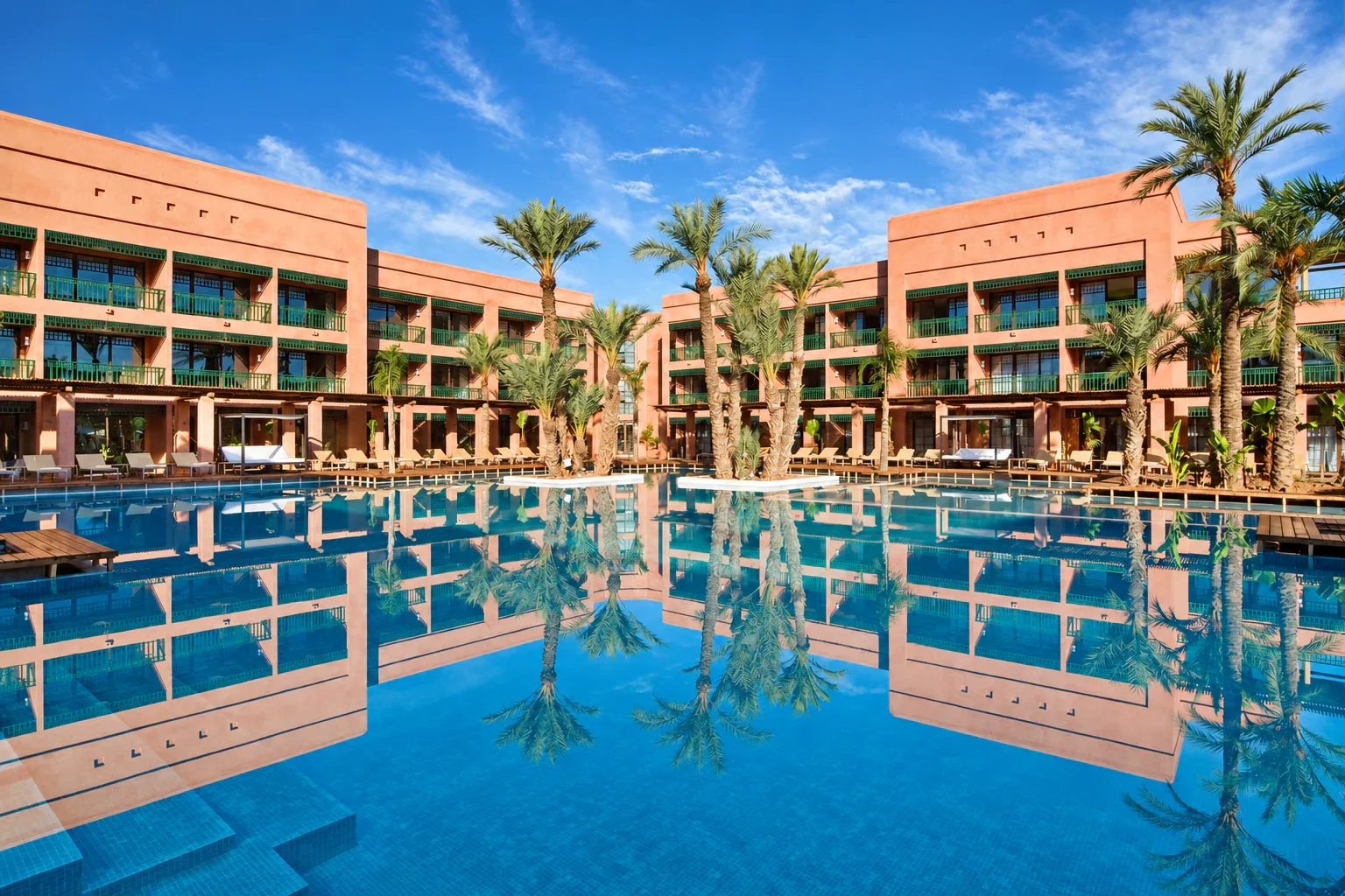 Pool and gardens at Hotel du Golf by Pickalbatros, a golf resort hotel in Marrakech